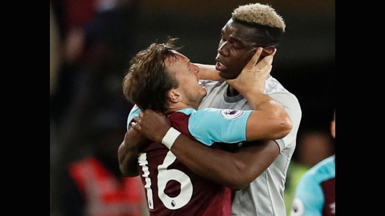 West Ham's Mark Noble, left, clashes with Manchester United's Paul Pogba during a Premier League match in London on Thursday, May 10.