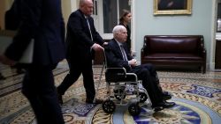 WASHINGTON, DC - NOVEMBER 30:  Sen. John McCain (R-AZ) moves through the U.S. Capitol in a wheelchair November 30, 2017 in Washington, DC. The Senate is debating the proposed GOP tax reform bill and hopes to pass it before the end of the week.  (Photo by Chip Somodevilla/Getty Images)