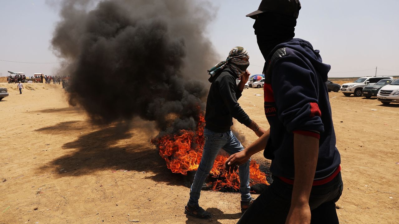  Palestinians burn tires near the border fence with Israel.