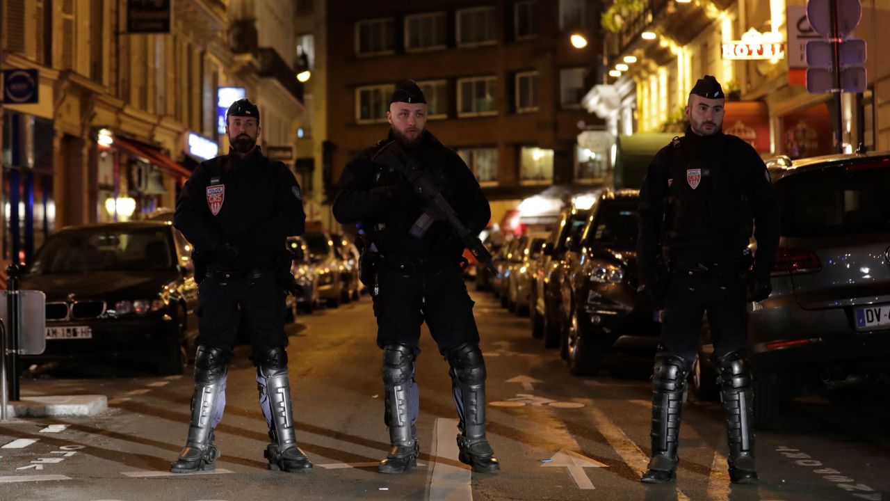 Policemen stand guard in Paris centre after one person was killed and several injured in a knife attack in Paris on May 12, 2018. - The assailant was killed by police. (Photo by Thomas SAMSON / AFP)        (Photo credit should read THOMAS SAMSON/AFP/Getty Images)