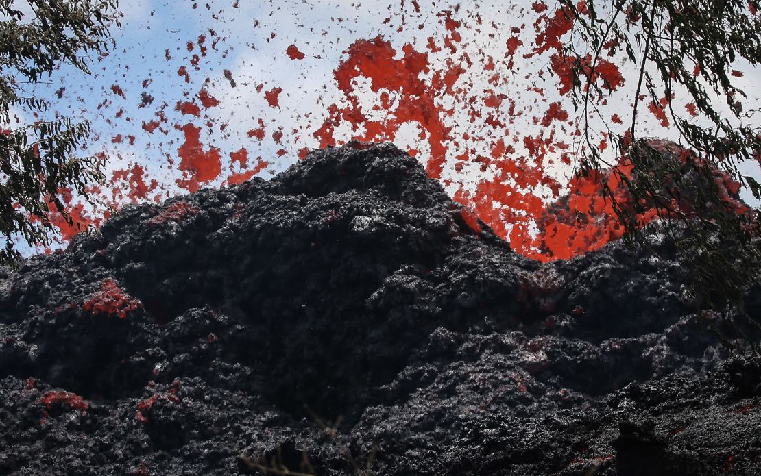 A fissure spews lava in Pahoa, Hawaii, after a massive eruption of the Kilauea volcano.