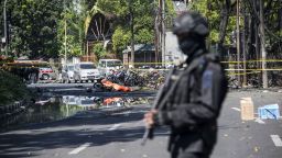 An Indonesian anti-terror policeman stands guard at the blast site following a suicide bomb outside a church in Surabaya on May 13, 2018. - A wave of blasts including a suicide bombing struck outside churches in Indonesia, killing at least six and wounding dozens of others, police said, the latest assault on a religious minority in the world's biggest Muslim-majority country. (Photo by JUNI KRISWANTO / AFP)        (Photo credit should read JUNI KRISWANTO/AFP/Getty Images)