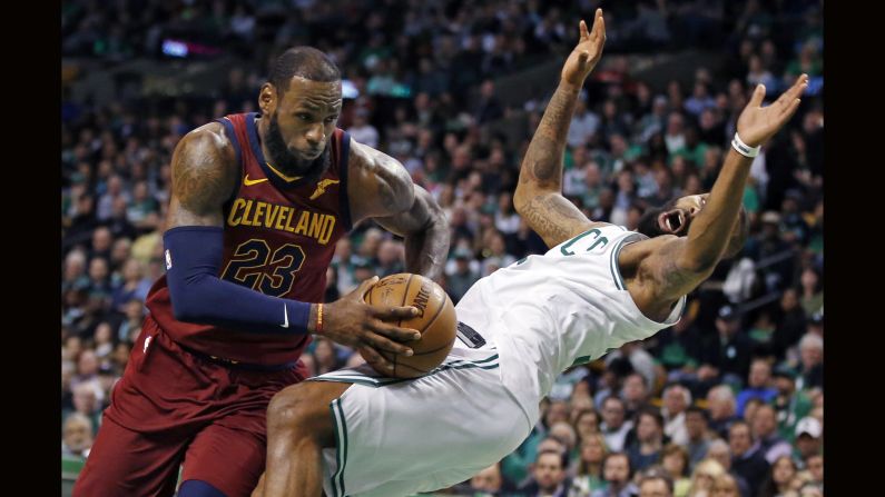 Cleveland Cavaliers forward LeBron James drives against the defense of Boston Celtics forward Marcus Morris during the first quarter of Game 1 of the NBA basketball Eastern Conference Finals on Sunday, May 13, in Boston.