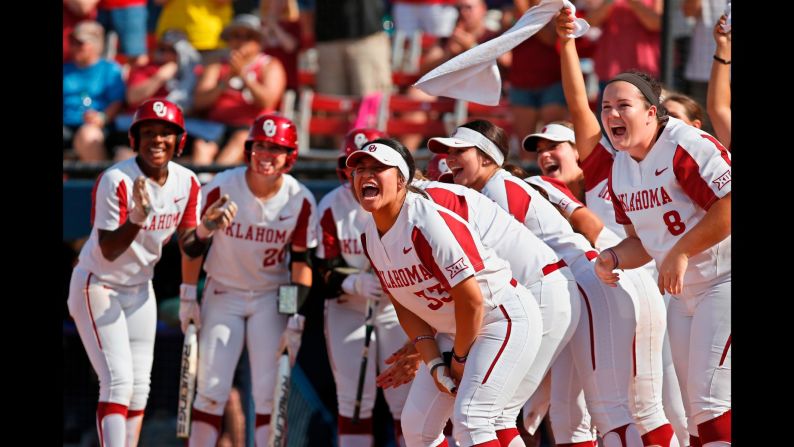 Oklahoma players celebrate at home plate as they wait for Nicole Pendley after a home run by Pendley against Baylor in the third inning during the championship game of the Big 12 softball tournament in Oklahoma City on Saturday, May 12. 