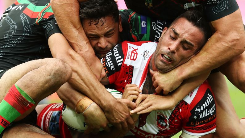 Paul Vaughan of the Dragons is tackled by the Rabbitohs' defense during the round 10 NRL rugby match between the South Sydney Rabbitohs and the St. George Illawarra Dragons at ANZ Stadium on Sunday, May 13, in Sydney.