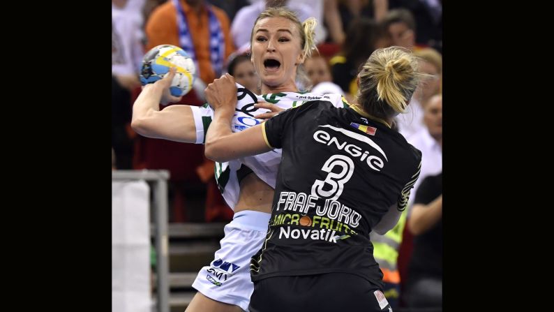Stine Bredal Oftedal of Gyori Audi ETO of Hungary, left, in action against Marit Malm Frafjord of CSM Bucuresti of Romania during their EHF Women's Handball Champions League Final Four match in Laszlo Papp Sports Arena in Budapest, Hungary, Saturday, May 12.
