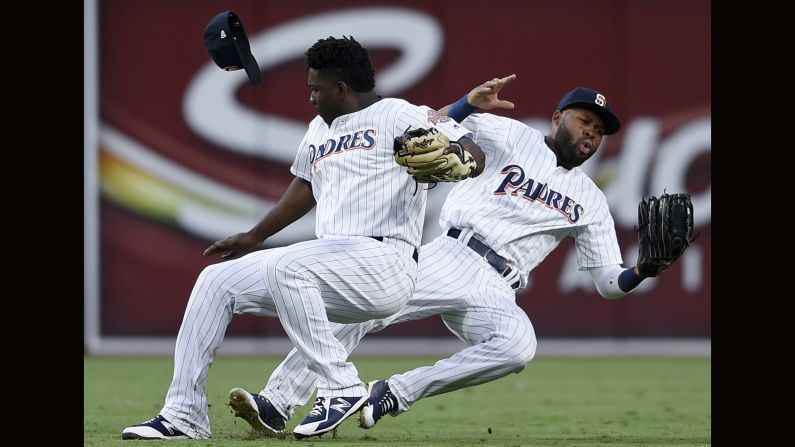 San Diego Padres second baseman Jose Pirela, left, collides with center fielder Manuel Margot while Pirela caught a popup hit by St. Louis Cardinals' Marcell Ozuna during the sixth inning of a baseball game in San Diego on Saturday, May 12.