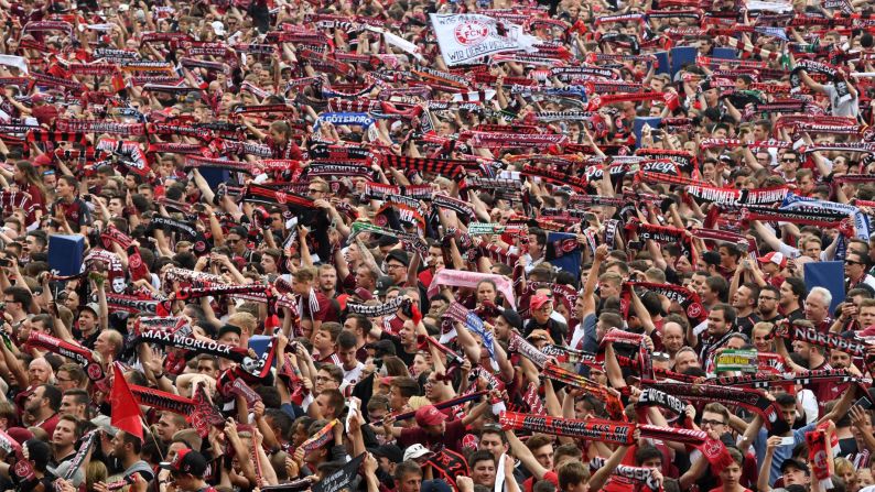 Nuremberg's supporters stand at the field at the end of the German second division Bundesliga football matchup of FC Nuremberg vs Fortuna Dusseldorf in Nuremberg, Germany, on Sunday, May 13, Duesseldorf won the match 3-2.