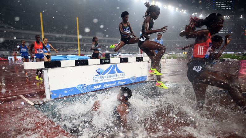 Athletes compete during the women's 3000 meter steeplechase of the IAAF Diamond League Shanghai athletics competition in Shanghai, China, on Saturday, May 12.