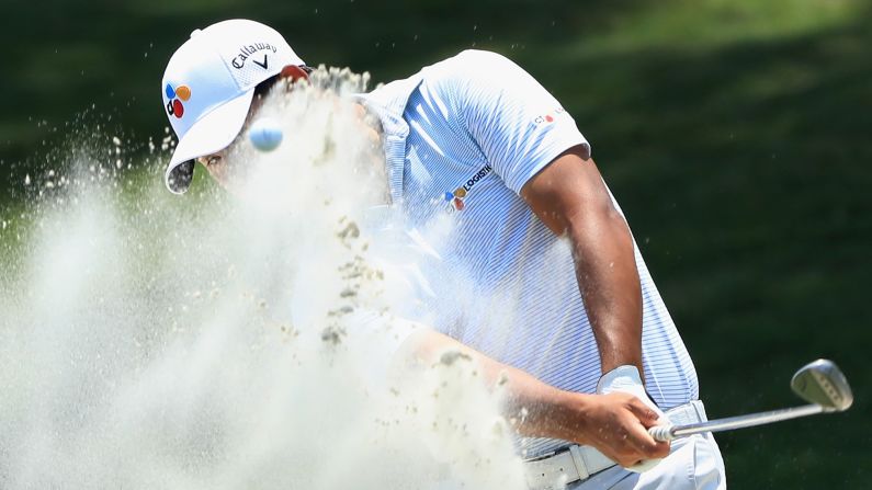 Si Woo Kim of South Korea plays a shot from a bunker on the ninth hole during the first round of The Players Championship on Thursday, May 10, in Ponte Vedra Beach, Florida.  