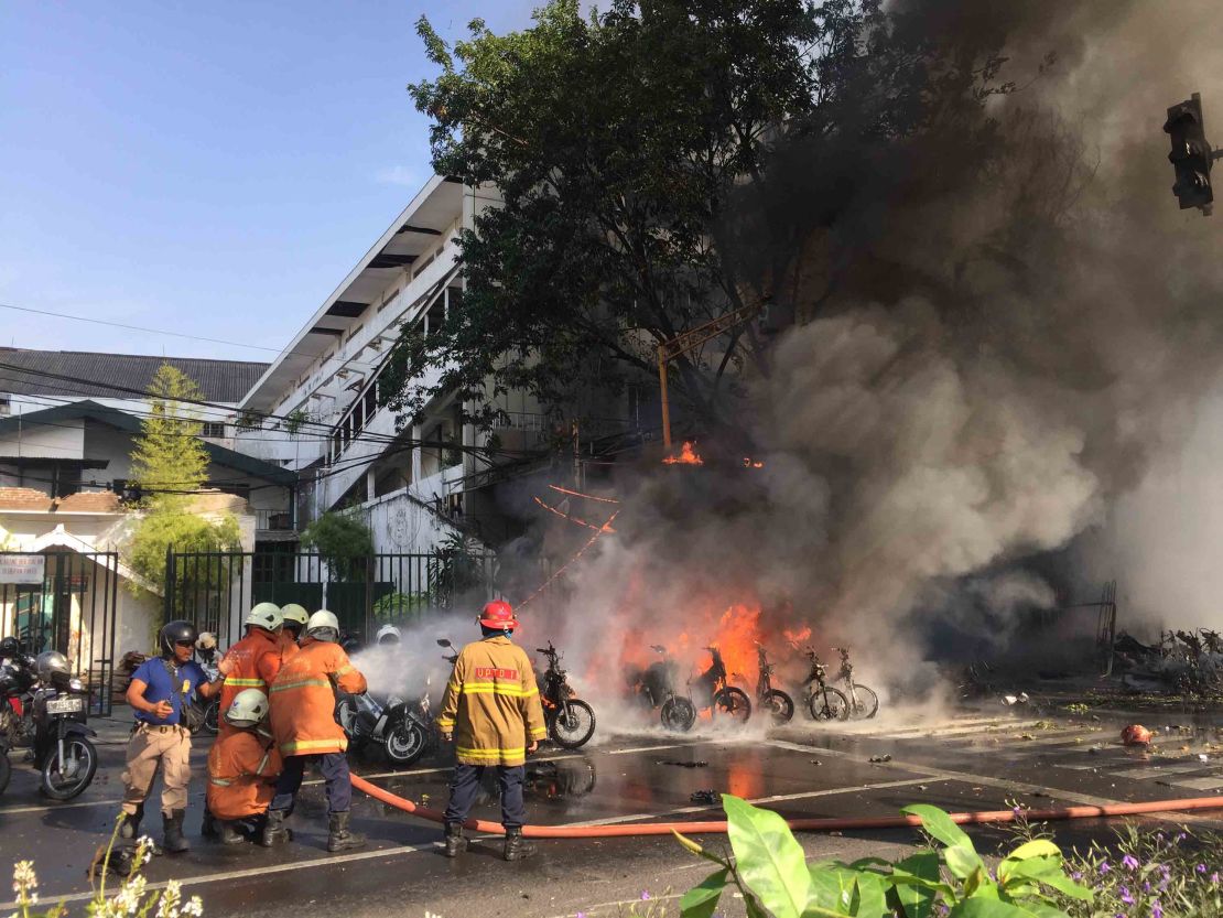 The scene outside the bomb blast Sunday at the Pentecostal Central Church in Surabaya.