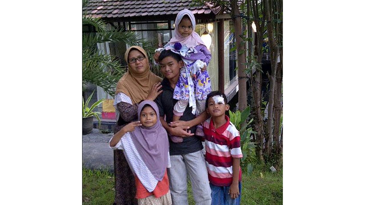 An old family photograph of Puji Kuswati and her children, who carried out suicide bombings in Surabaya on Sunday.