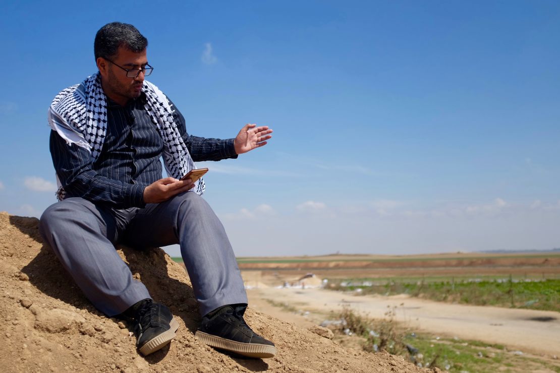 Protest leader Ahmad Abu Artema reads poetry near the Gaza border.