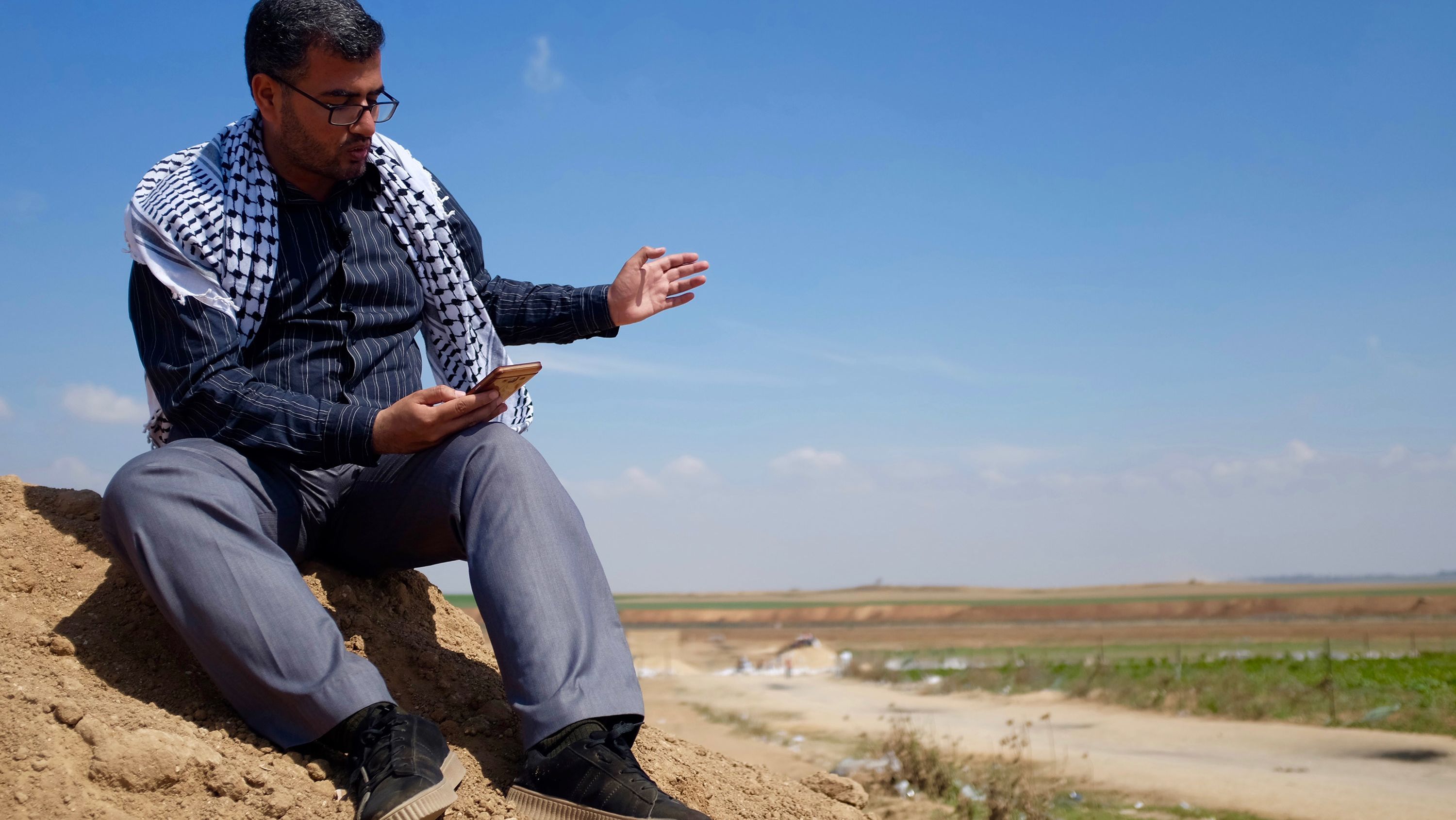 Protest leader Ahmad Abu Artema reads poetry near the Gaza border.
