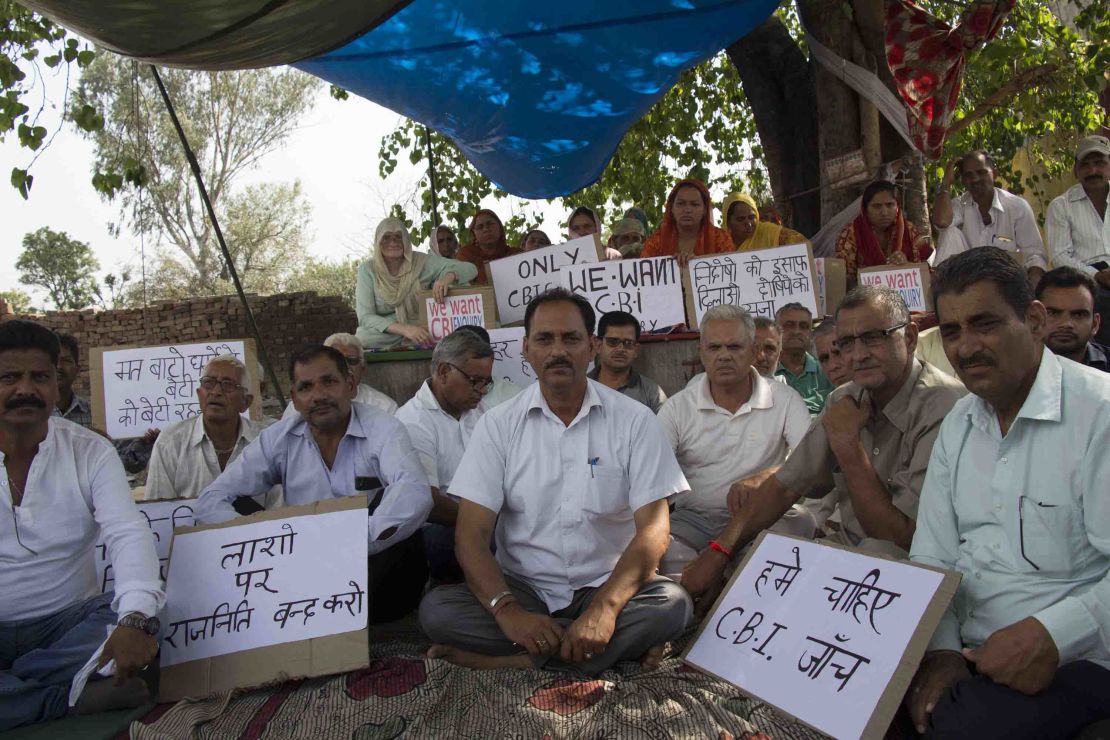 Hindu Ekta Manch's president Vijay Kumar Sharma (center, white shirt). Members of the activist group maintain that the accused men are innocent and are calling for an independent  investigation.  