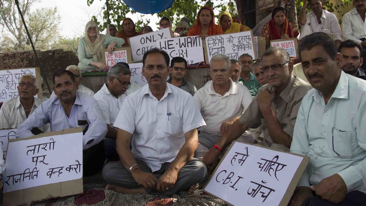 Hindu Ekta Manch's president Vijay Kumar Sharma (center, white shirt). Members of the activist group maintain that the accused men are innocent and are calling for an independent investigation.