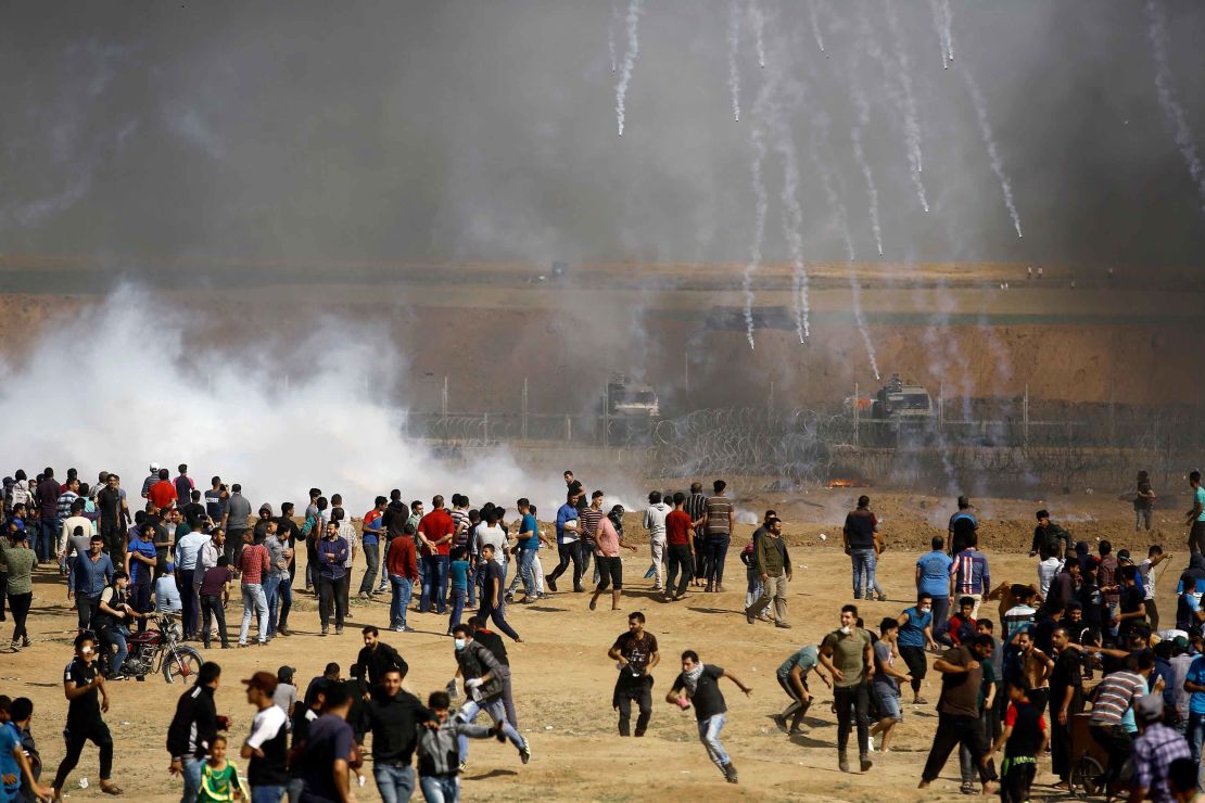 Israeli forces fire teargas canisters toward Palestinian demonstrators at the Gaza border on Friday, May 11.