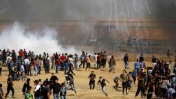Israeli forces fire teargas canisters toward Palestinian demonstrators during clashes along the border with the Gaza strip on the eastern outskirts of Jabalia on May 11, 2018, as Palestinians demonstrate for the right to return to their historic homeland in what is now Israel. - Over fifty Palestinians have been killed by Israeli fire since protests and clashes began on March 30 calling for Palestinian refugees to be able to return to their former homes in what is now Israel. (Photo by MOHAMMED ABED / AFP)        (Photo credit should read MOHAMMED ABED/AFP/Getty Images)