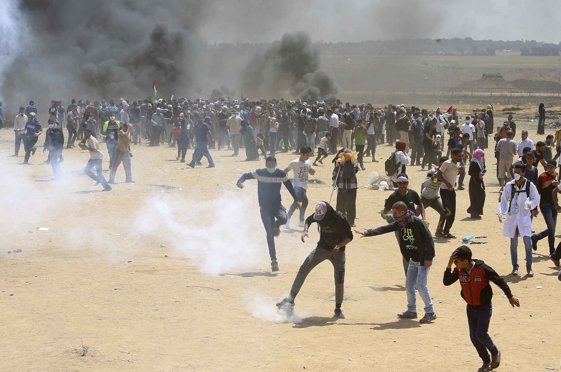 Palestinians demonstrate near the Gaza border fence on Monday.