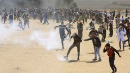 Palestinian protesters burn tires near the Israeli border fence, east of Khan Younis, in the Gaza Strip, Monday, May 14, 2018. Thousands of Palestinians are protesting near Gaza's border with Israel, as Israel prepared for the festive inauguration of a new U.S. Embassy in contested Jerusalem. (AP Photo/Adel Hana)