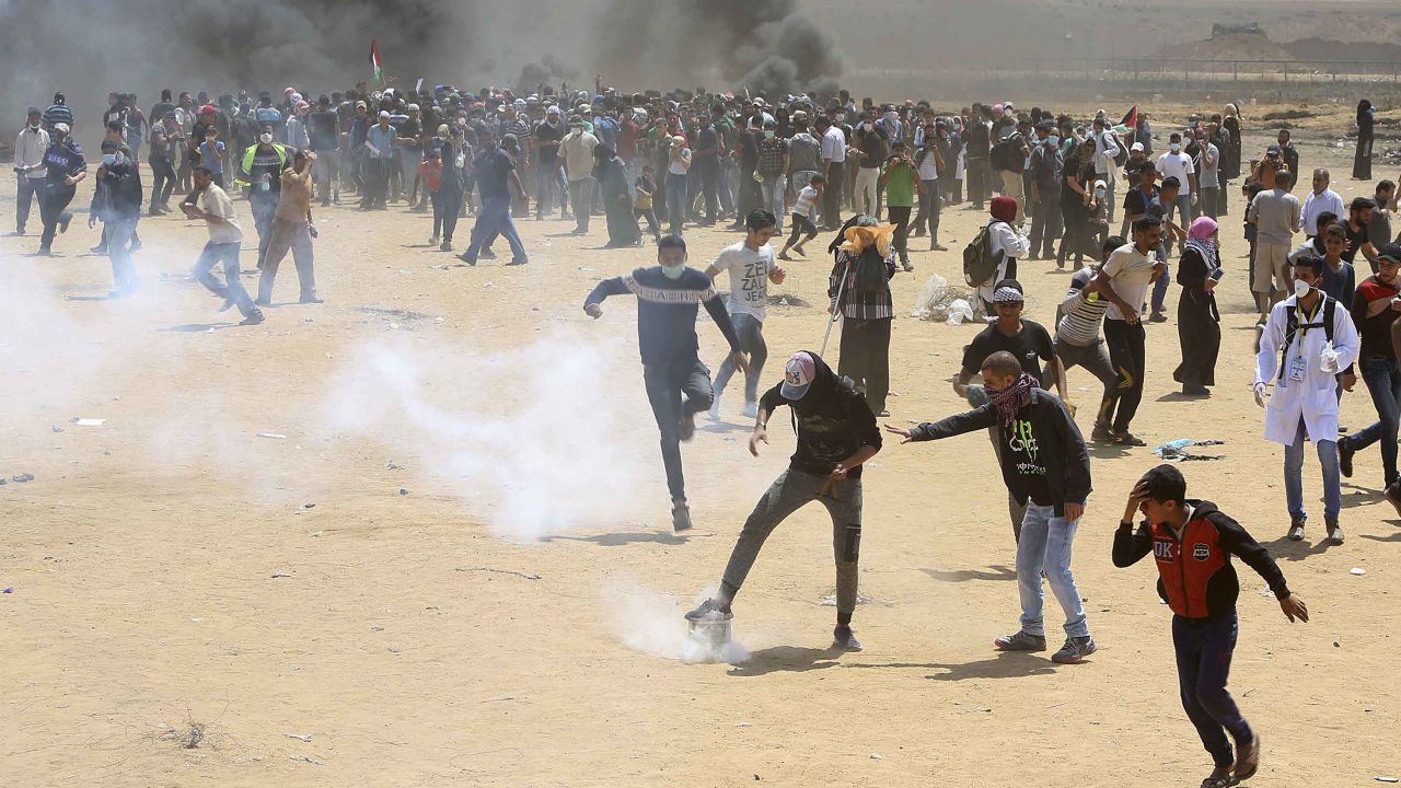 Palestinians demonstrate near the Gaza border fence on Monday.