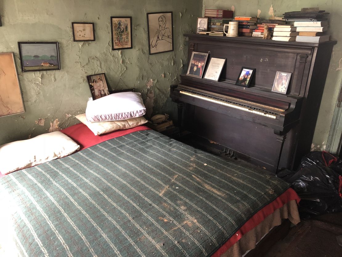 This is O'Grady's bedroom. Her family photos partially cover a wall that's desperate for a paint job. 