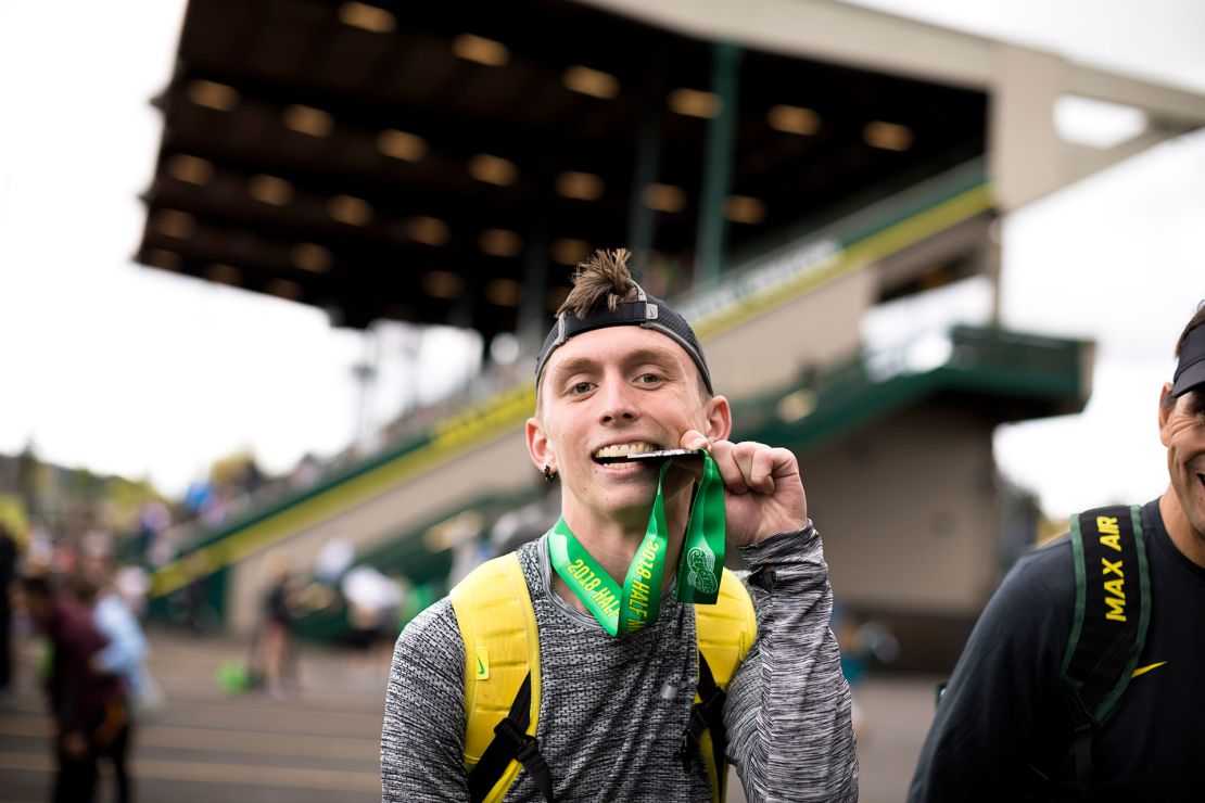 Gallegos proudly showing off his medal after completing the 2018 Eugene Half Marathon.