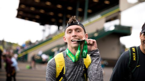 Gallegos proudly showing off his medal after completing the 2018 Eugene Half Marathon.