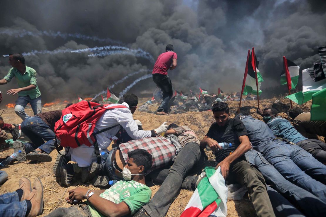 Palestinians set tires on fire during a protest on Monday.