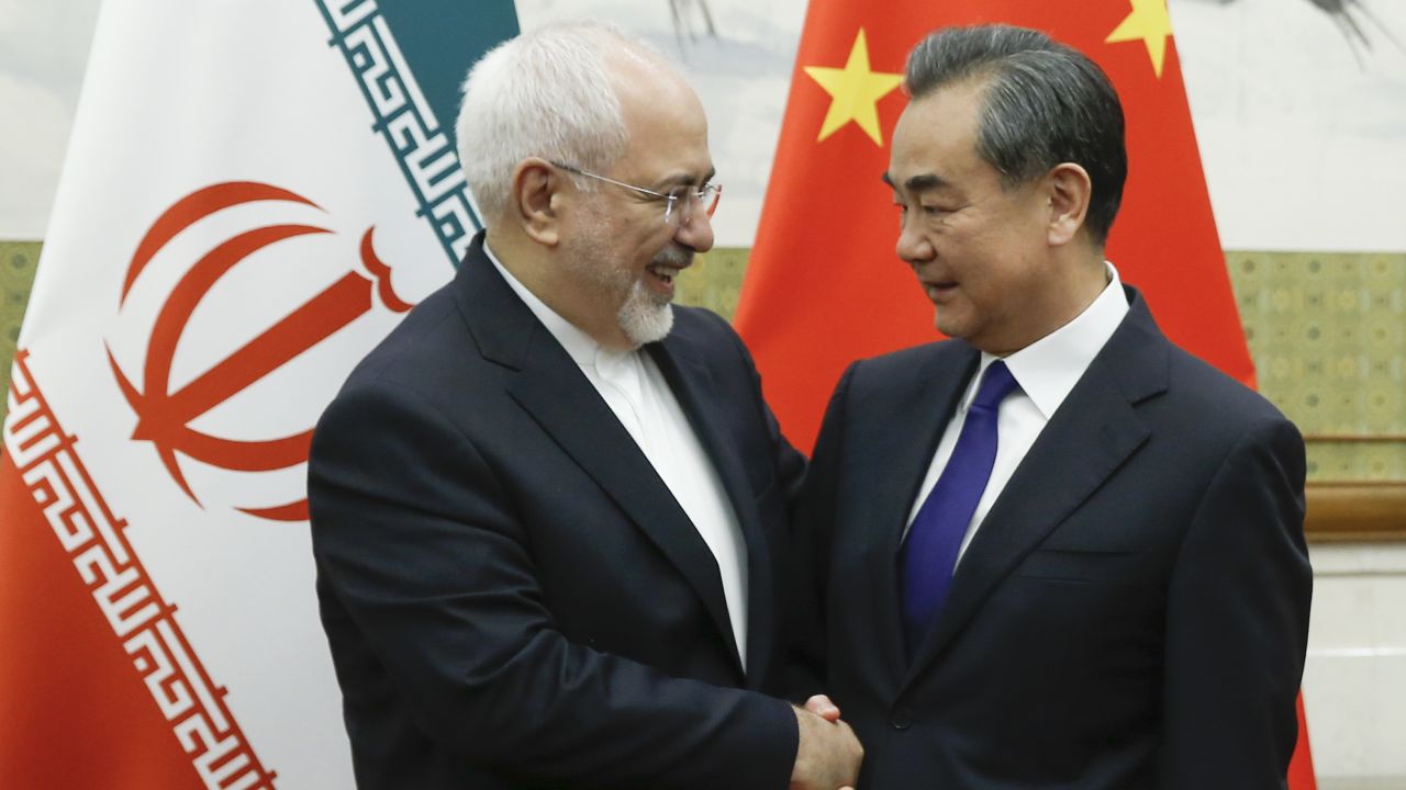 Chinese State Councillor and Foreign Minister Wang Yi (R) meets Iran's Javad Zarif at the Diaoyutai state guesthouse in Beijing on May 13.