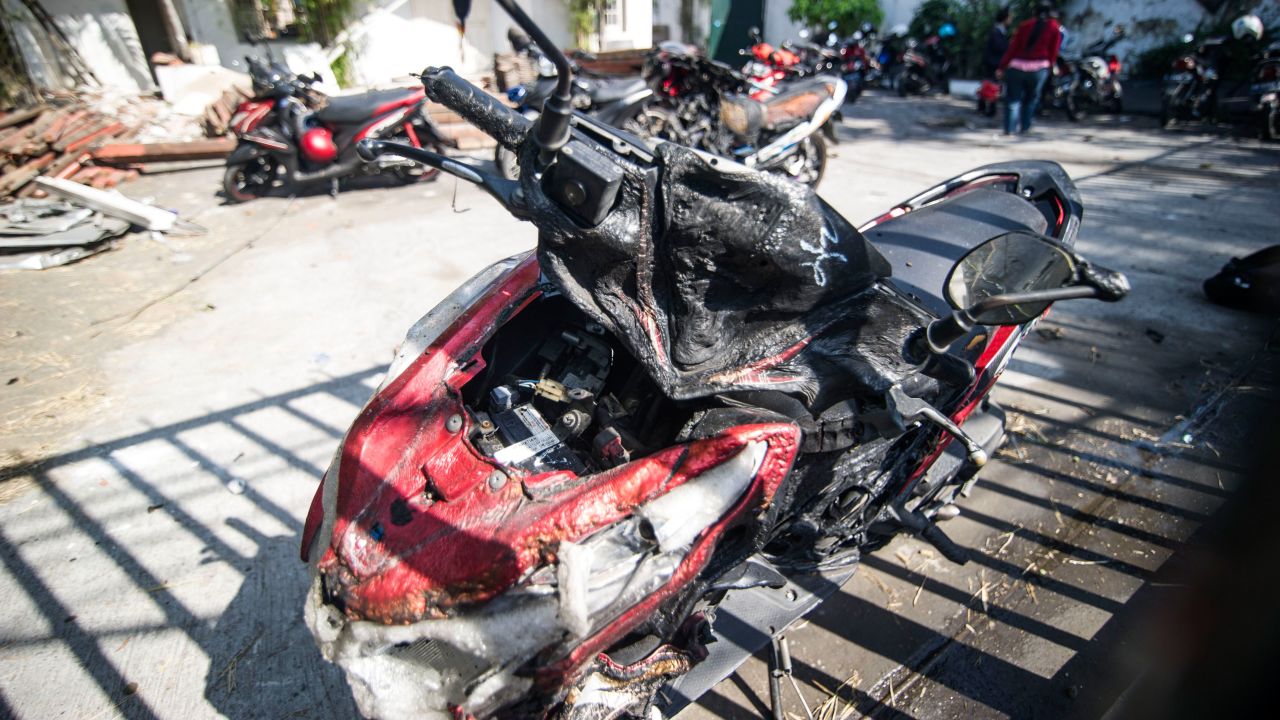 A damaged motorcycle is seen outside the Surabaya Centre Pentecostal Church in Surabaya on May 14.