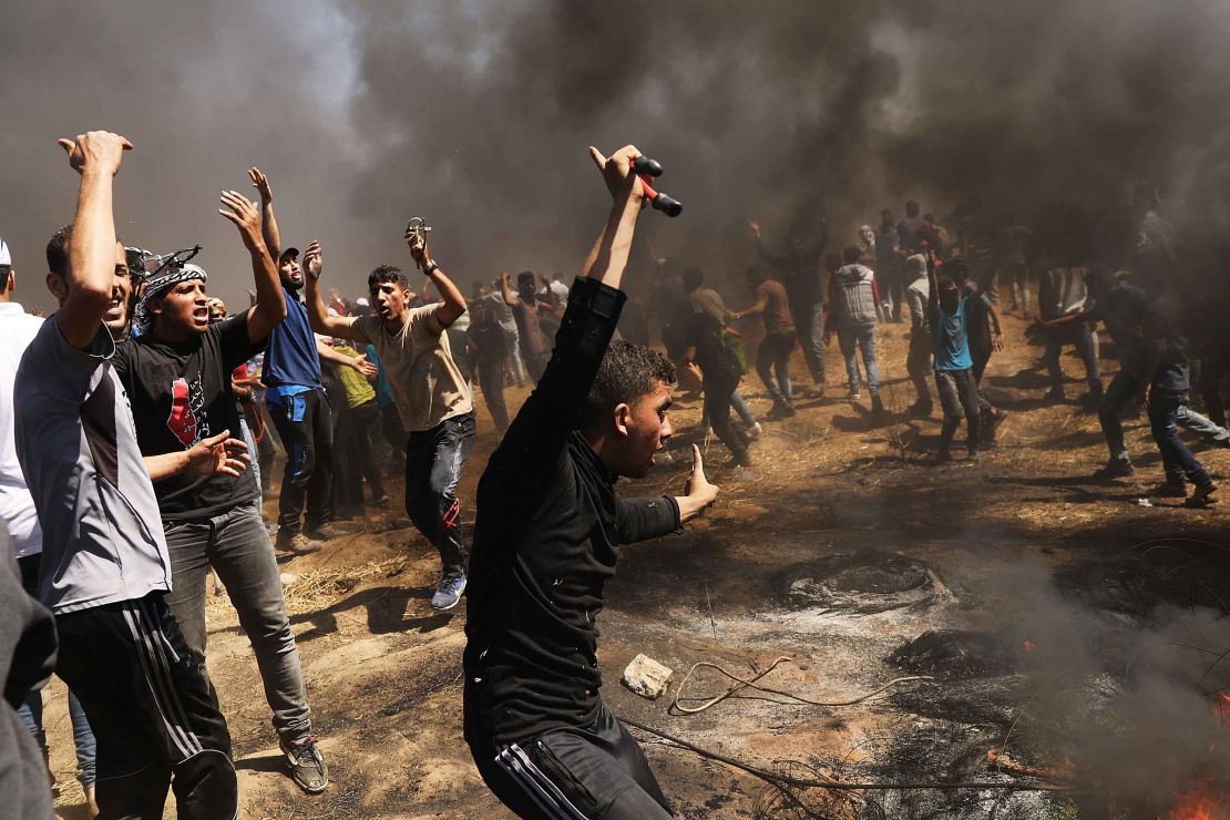 Palestinians protest near the border fence with Israel on Monday.