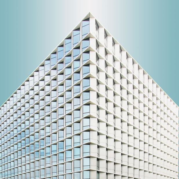 Angled glazing and cladding form a mesmerizing facade for 3Cubes, a series of three office buildings in Shanghai.