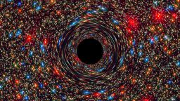 A computer-simulated image of a supermassive black hole at the core of a galaxy.