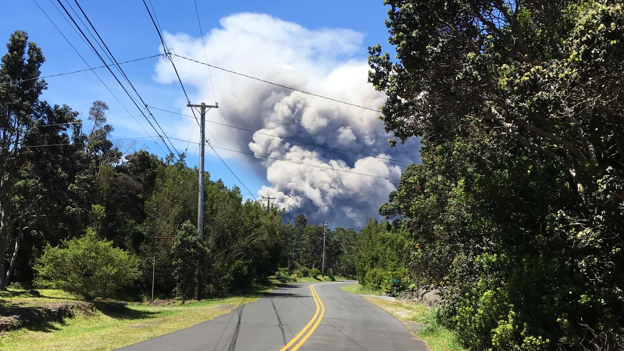 Ash plume is visible Tuesday near the Volcano Golf & Country Club, about 2 miles from Kilauea's crater.
