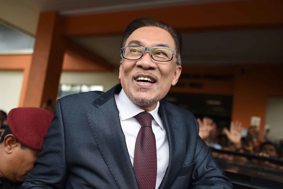 Anwar Ibrahim greets supporters after his release from the Cheras Hospital Rehabilitation in Kuala Lumpur on May 16, 2018.