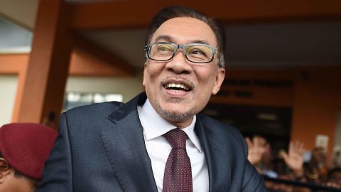 Anwar Ibrahim greets supporters after his release from the Cheras Hospital Rehabilitation in Kuala Lumpur on May 16, 2018.