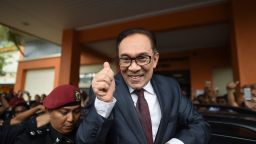 Jailed former opposition leader and current Federal opposition leader Anwar Ibrahim greets supporters after his released from the Cheras Hospital Rehabilitation in Kuala Lumpur on May 16, 2018. - The release of Anwar from prison marks yet another sharp turn in a roller-coaster political life that has left a profound mark on Malaysian politics and society. Anwar was pardoned and released on on May 16, 2018 after serving three years for a sodomy conviction widely considered a railroad job and now quashed following the stunning defeat of a Malaysian regime that had ruled for six decades. (Photo by MOHD RASFAN / AFP)        (Photo credit should read MOHD RASFAN/AFP/Getty Images)