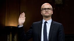 Christopher Wylie, a whistleblower and former employee with Cambridge Analytica, swears in to a Senate Judiciary Committee hearing in Washington, D.C., U.S., on Wednesday, May 16, 2018. Cambridge Analytica is a U.K.-based data broker that improperly gained access to tens of millions of Facebook users' personal data. The firm, which announced its dissolution earlier this month, used the Facebook data in targeted influence campaigns for Donald Trump's 2016 presidential campaign. Photographer: Andrew Harrer/Bloomberg via Getty Images