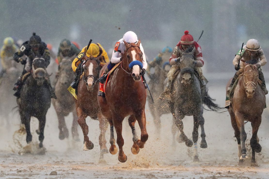 Justify (center) won the wettest Kentucky Derby on record at Churchill Downs in early May.