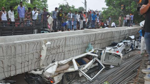 At least four cars were crushed when a section of an overpass collapsed on Tuesday evening, in Varanasi, India. 