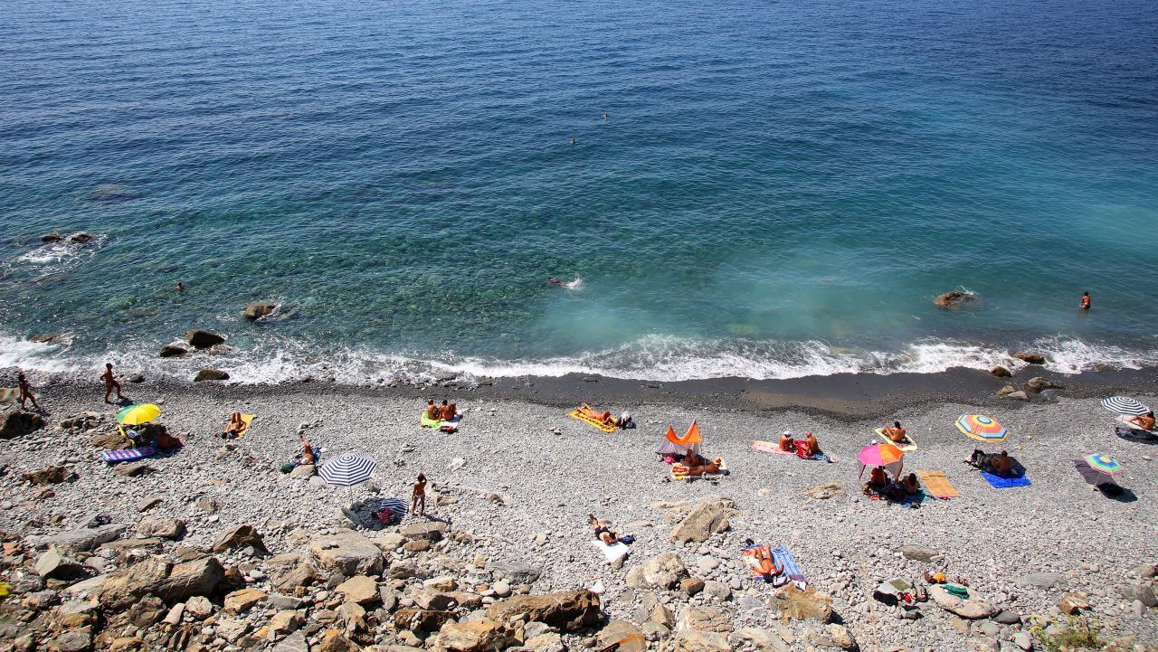 <strong>Spiaggia de Guvano, Vernazza, Italy:</strong> Located on the Cinque Terre, this primo Italian nude beach can only be reached via an abandoned railway tunnel on a path from Corniglia village and has no facilities at all.