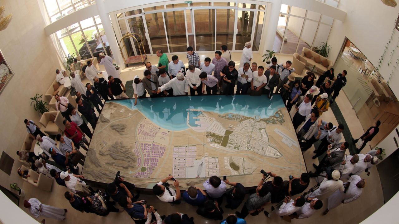 Chinese investors look at a scale model of a dry dock in Duqm in 2016.