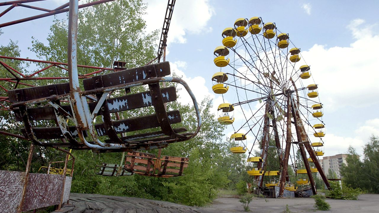 The abandoned ferris wheel and carousel in the amusement park of the ghost town of Prypyat.