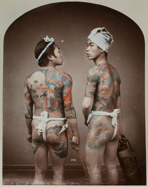 A photo shows two men tattooed with classic horimono. 