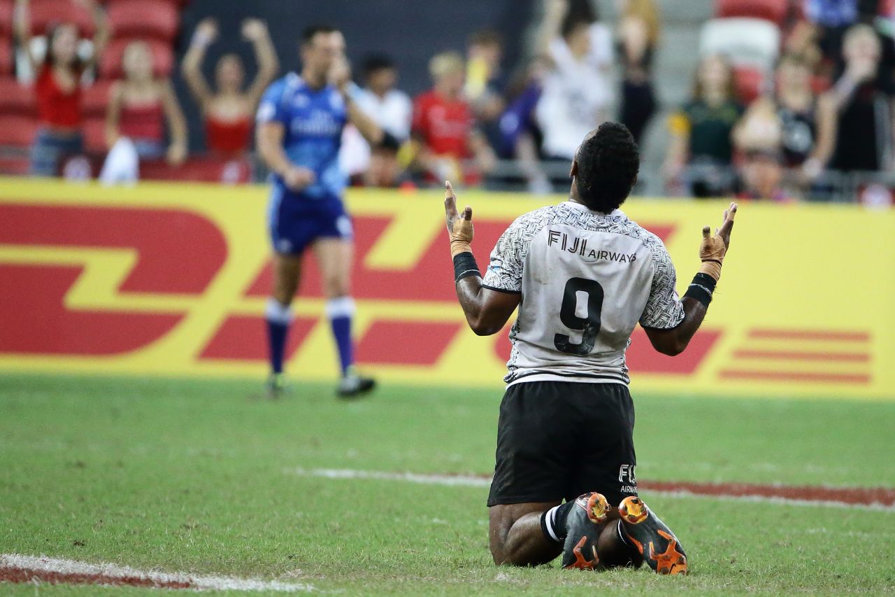 Jerry Tuwai sinks to his knees after his Fiji side scored a try in the last play of the game to win the Singapore Sevens title over Australia in April.