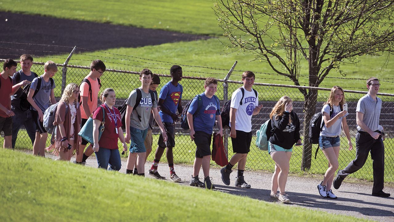 Students file out of Dixon High School in Illinois after a gunman opened fire in the school.