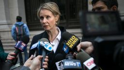 New York gubernatorial candidate Cynthia Nixon speaks with reporters following a rally against financial institutions' support of private prisons and immigrant detention centers, as part of a May Day protest near Wall Street in Lower Manhattan, May 1, 2018 in New York City.