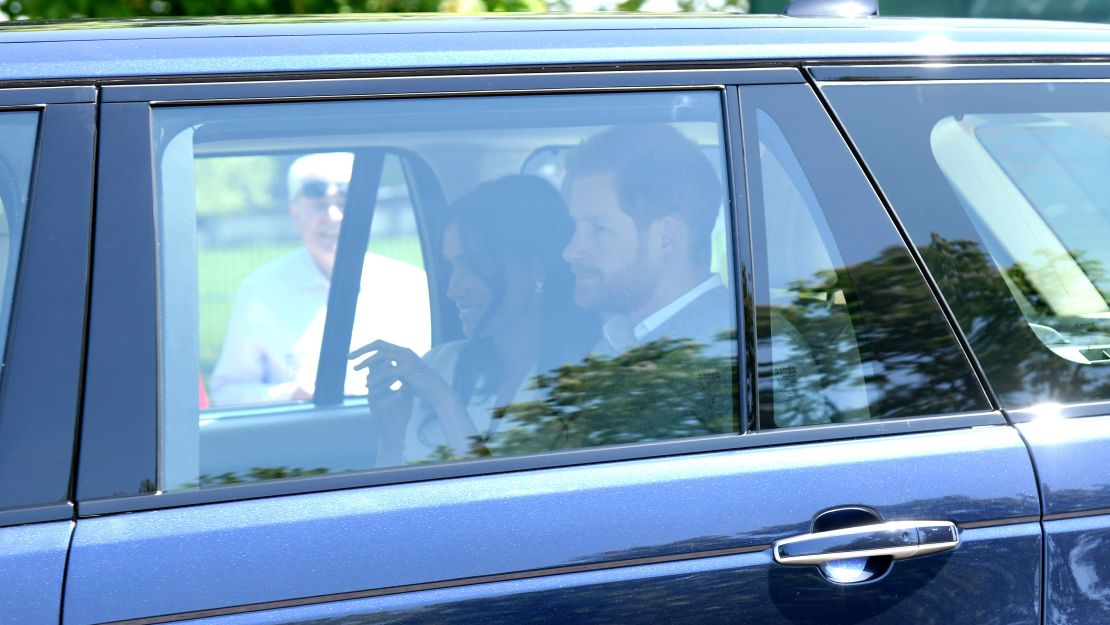Prince Harry and Meghan Markle arrive at Windsor Castle for wedding rehearsals Thursday.