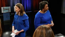 Georgia Democratic gubernatorial candidates and former state representatives, Stacey Evans, left, and Stacey Abrams talk to moderators after debating Tuesday, May 15, 2018, in Atlanta. (AP Photo/John Amis)